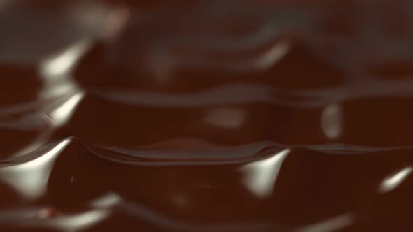 Super Slow Motion Detail Shot of Waving Melted Chocolate at 1000 Fps