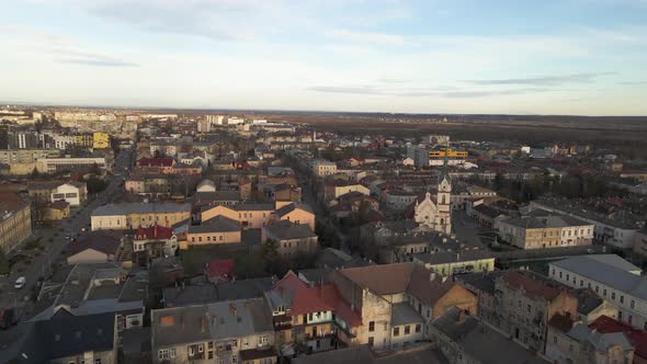 Aerial shot of golden sunlight hitting city of Lviv in Ukraine