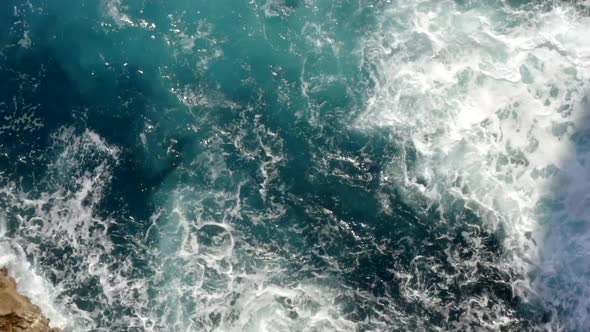 AERIAL: Birds View of Beautiful Ocean Blue Water on Rock Coast Crushing on Tropical Island Mallorca