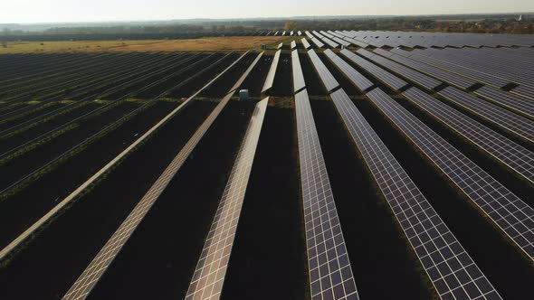 Drone Flight Over Rows of Solar Panels