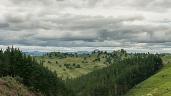 Cloudy day over green mountains nature in New Zealand landscape Time lapse