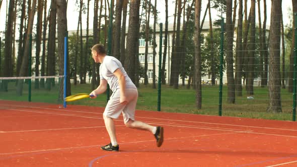 Tennis Player Running To the Net To Score a Point