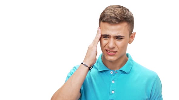 Sad Young Handsome Man Have Headache Over White Background Slow Motion