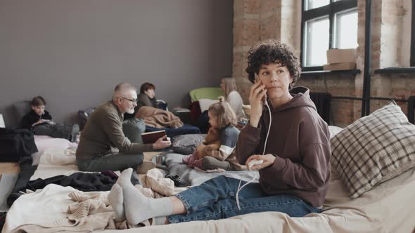 Woman Talking on Phone in Shelter