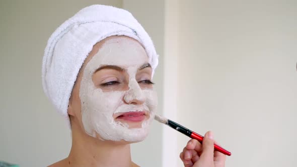 Beautiful Woman Having a Facial Treatment at Spa