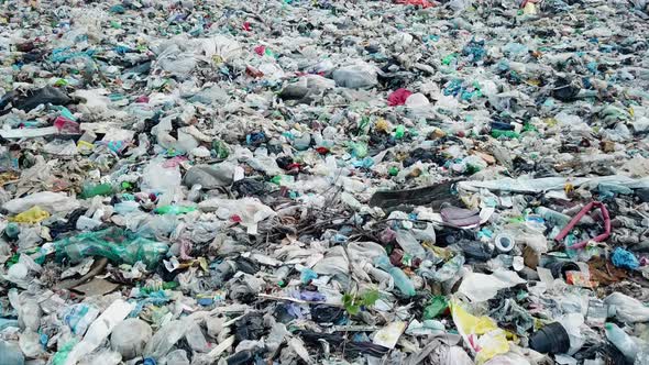 Plastic in the mountains, Mountain garbage, large garbage pile, degraded garbage.