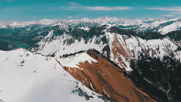 Aerial Drone View on Snowy Peaks of Swiss Alps. Switzerland. Rochers-de-Naye Mountain Peak.