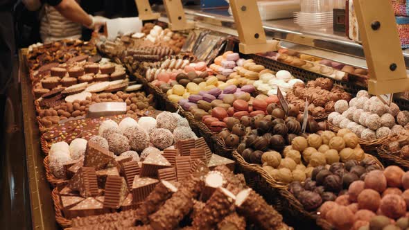 Colorful Chocolate Candies Lay on a Market Counter Closeup Close Up with Selective Focus