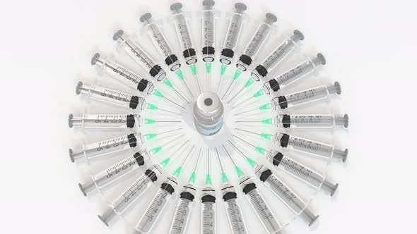 Vial with Coronavirus Vaccine and Syringes