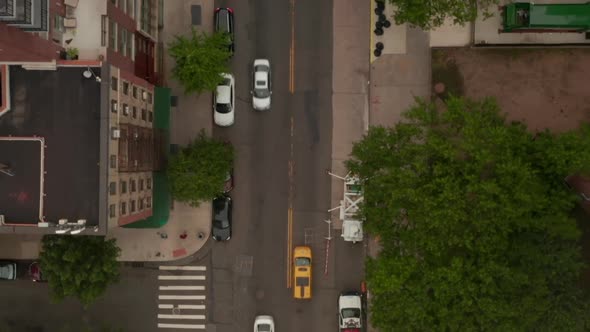 AERIAL: Overhead Top Down Birds View Flight Over Typical New York City Street with Car Traffic