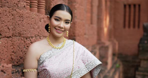 Portrait of Thai woman salute of respect in traditional costume of thailand