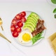 Healthy keto breakfast: egg, avocado, arugula, tomatoes and bacon. Stop Motion Animation - VideoHive Item for Sale