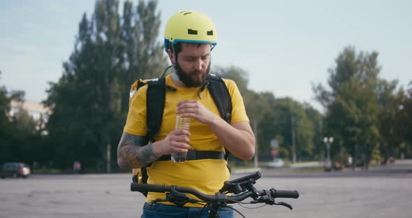 Bicycle Messenger Drinking Water