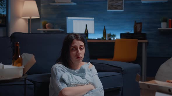 Unhappy Depressed Woman Crying Holding Pillow Sitting on Floor