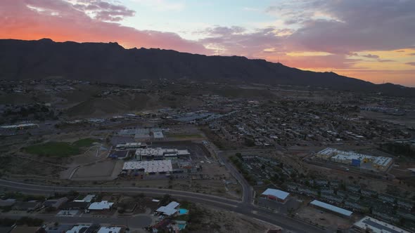 El Paso, Texas Westside with Sunrise Behind Franklin Mountains Landscape. 4K Aerial Drone Footage.