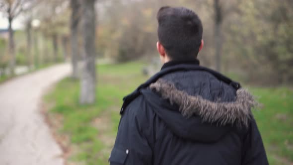  A Young Man Walks Through the Autumn Park.