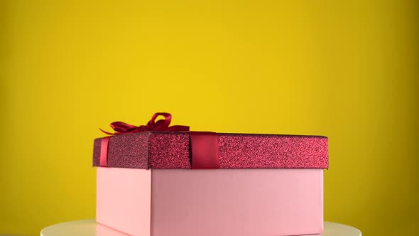 Holiday Gift Box Rotation on Yellow Background