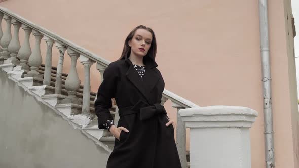 Cute Young Woman Posing on Camera Wearing Coat