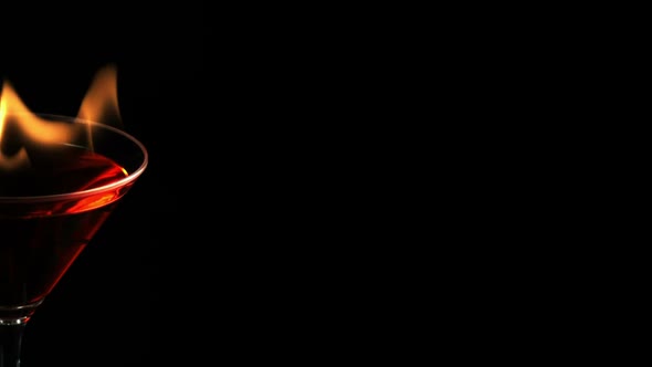 Fire blowing out of martini glass, Slow Motion alt