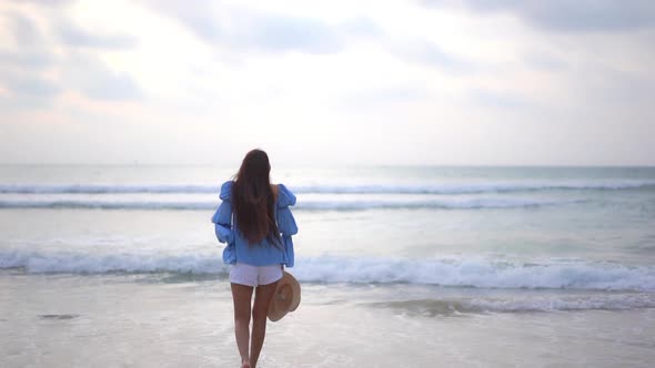 Asian woman enjoy around beautiful beach sea ocean