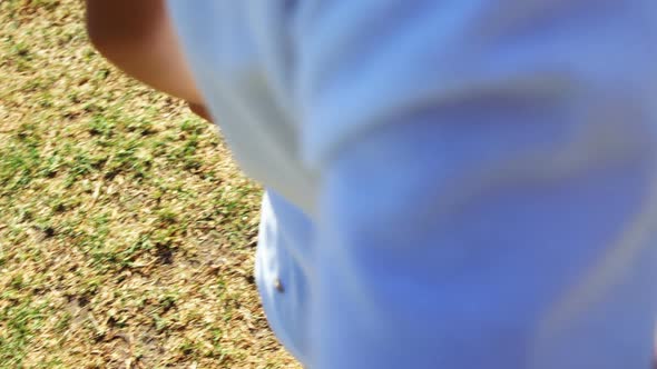 Children playing a sack race in park