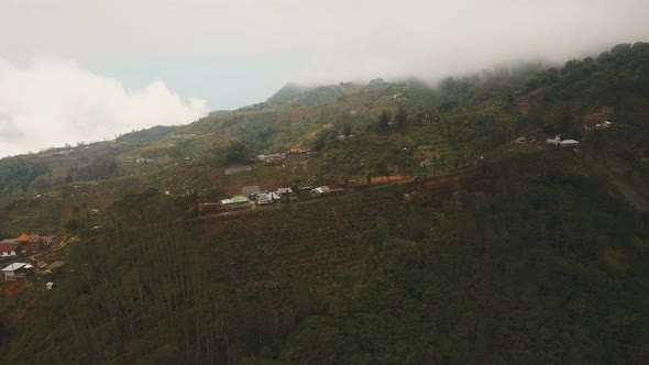 Farmland in the Mountains in Fog and Clouds