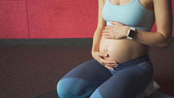 Pregnant Woman Stroking the Abdomen Yoga