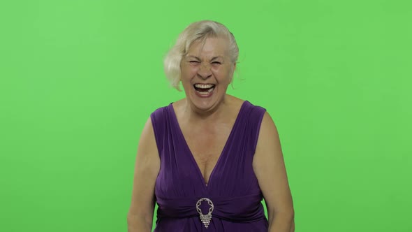 An Elderly Woman Laughing. Old Grandmother Smiles. Chroma Key