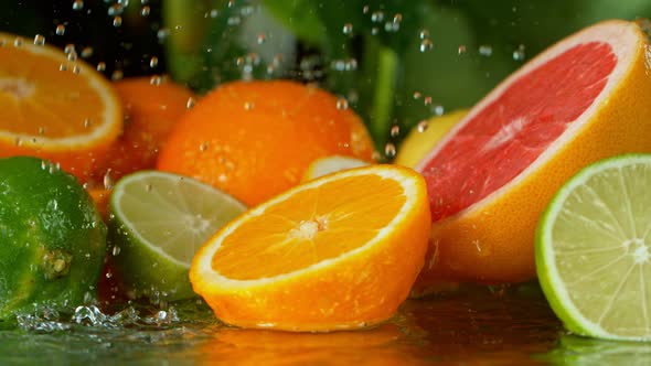 Super Slow Motion Shot of Splashing Water Drops on Variation of Citruses at 1000Fps