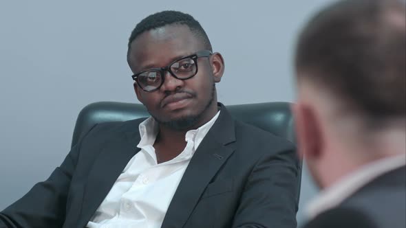 Afro American Businessman Listening To His Partner Carefully