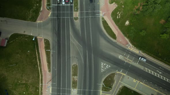 Crossroads Of A Large City Highway. Taken From Above. The Flow Of Cars Is At A Traffic Light.