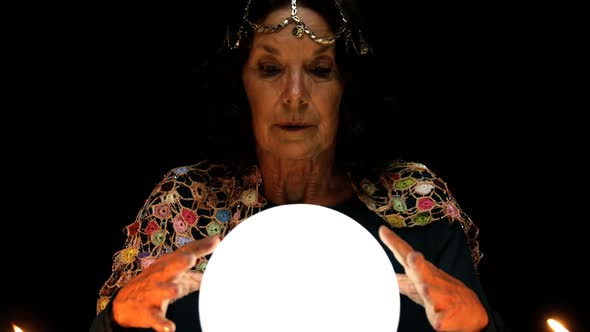 Clairvoyant looking in her crystal ball