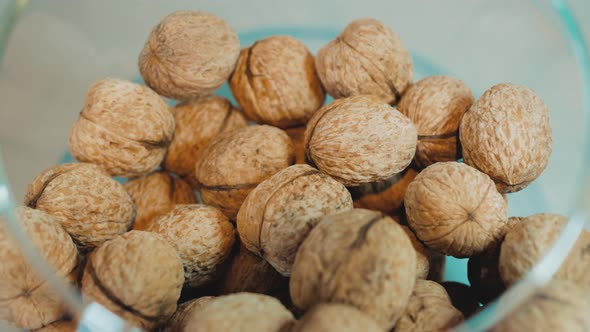 The Rounded Food Container Contains Walnuts Nuts in Woody Shells