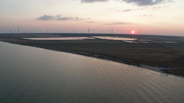 Drone View of Azov Sea and Windfarm at Sunset