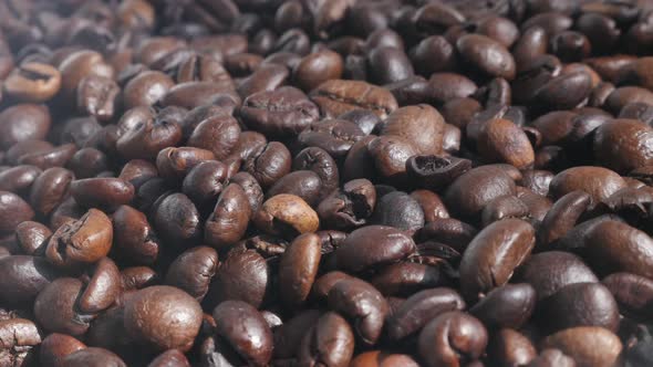 Pile of roasted  coffee beans  4K panning footage