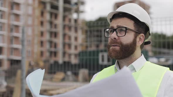 Portrait of a Successful Young Engineer or Architect Wearing a White Helmet