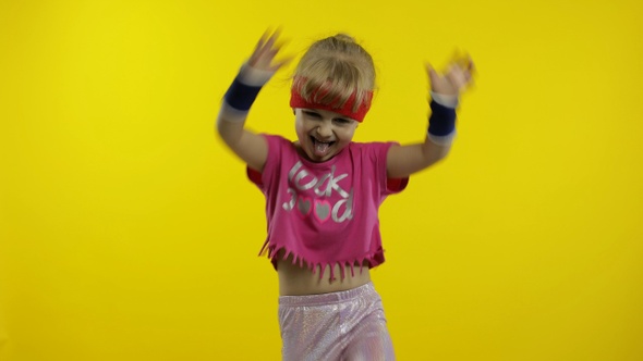 Little Energetic Caucasian Girl in Pink Sportswear Making Fit Dance, Modern Aerobic Dancer