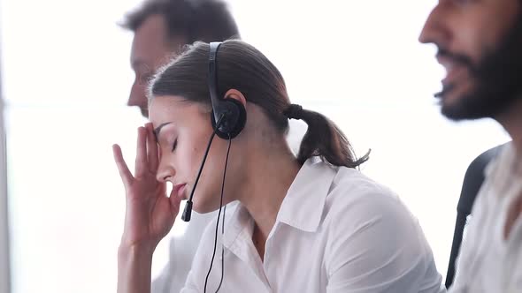 Contact Center. Woman Operator With Headache And Stress At Work