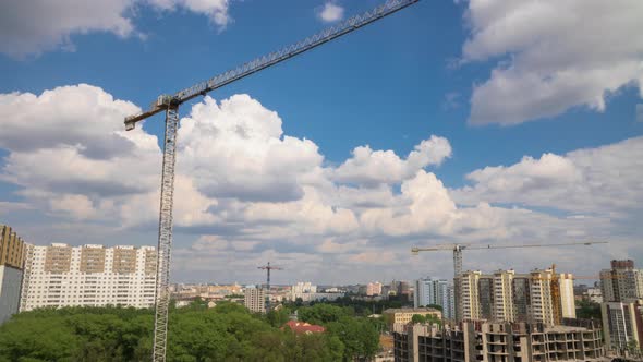 Construction Site Residential, Tower Cranes Working on Building, Cityscape, Sunny Day Moving Clouds
