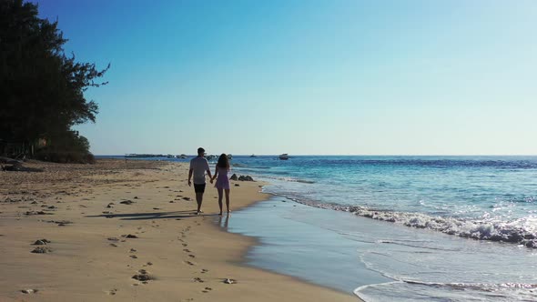 Fun lady and man after marriage in love live the dream on beach on sunny white sandy background 4K