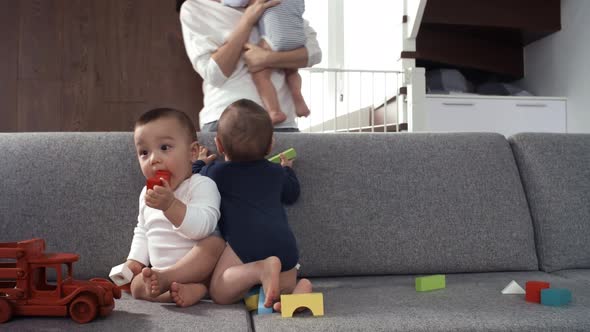 Baby Brother Joining his Twin Siblings on Couch