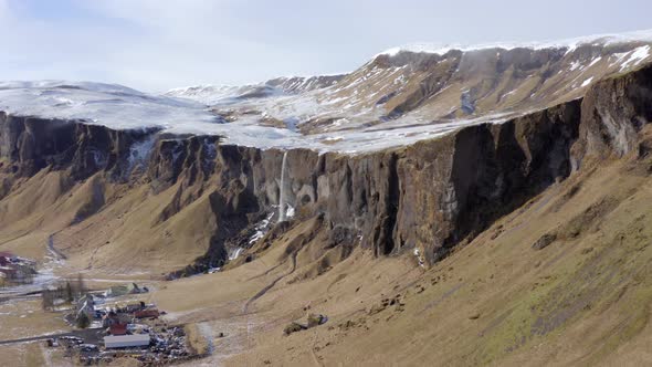 Small and Beautiful Waterfall on a Snowcapped Mountain in the Winter