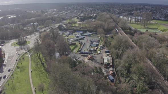 Slow drone shot towards house narrow boat crane at repair marina UK