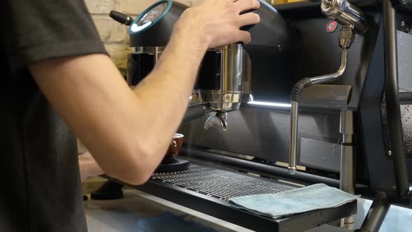 Unrecognizable Man Preparing Espresso or Americano Using Coffee Machine