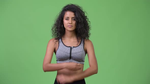 Young Beautiful Hispanic Woman with Arms Crossed Ready for Gym