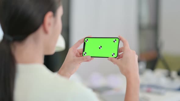 Holding Horizontal Smartphone with Green Chroma Key Screen