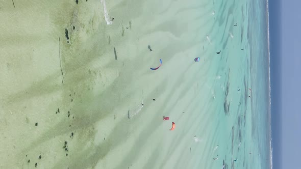 Vertical Video Kitesurfing Near the Shore of Zanzibar Tanzania Aerial View