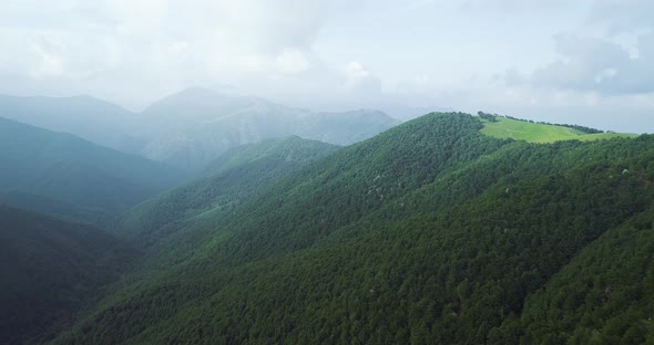 Aerial of Flying Over a Beautiful Green Mountain Forest