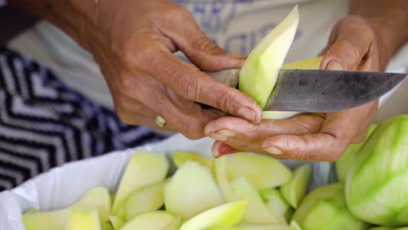 Women Are Cutting Mangoes