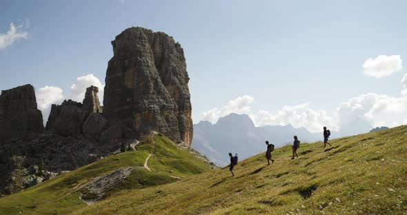 Four Friends Walking Along Wild Hiking Trail Path